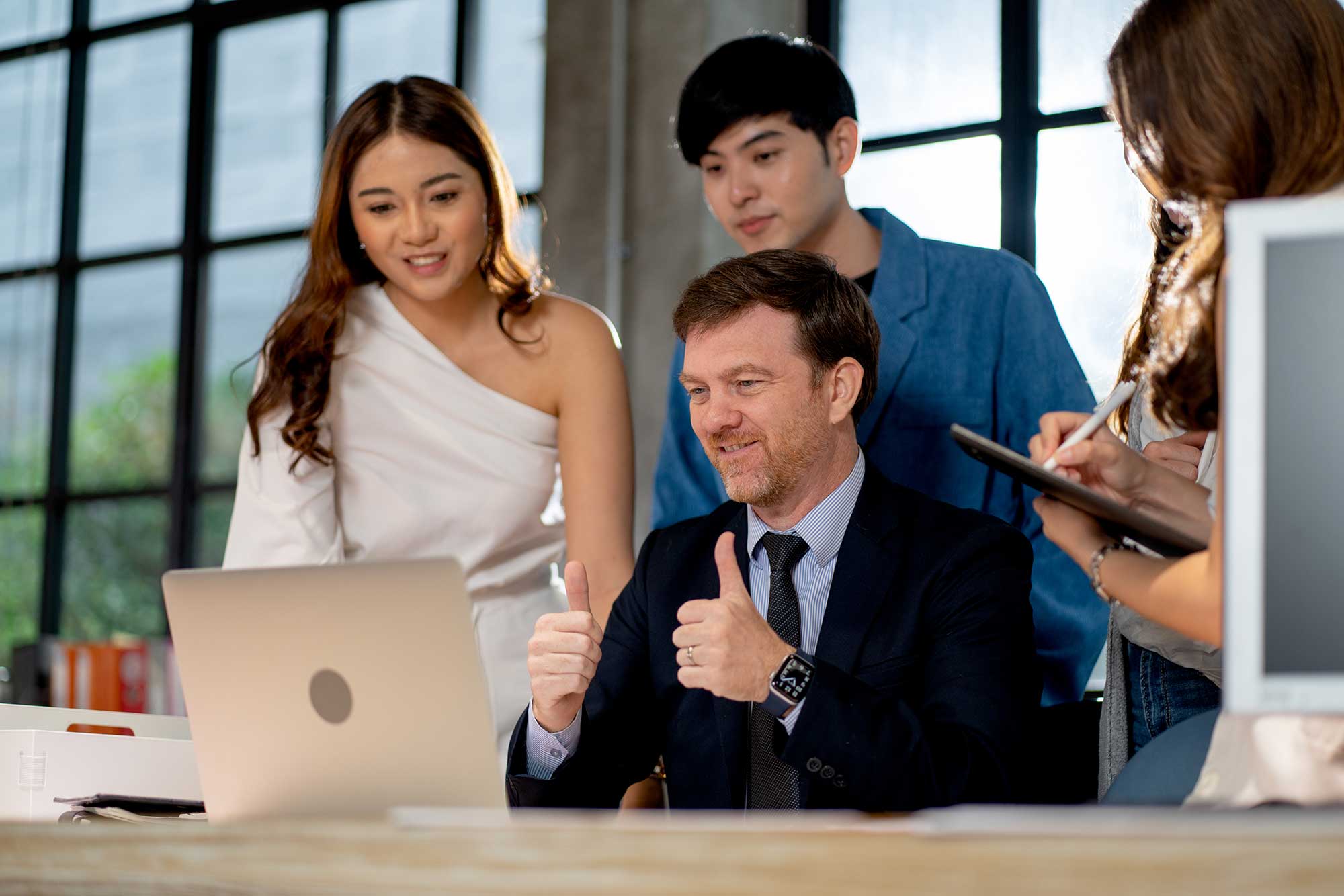 business-manager-show-thumbs-up-and-stay-with-his-2023-11-27-05-16-43-utc